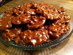 A glass dish filled with chocolate-covered treats.